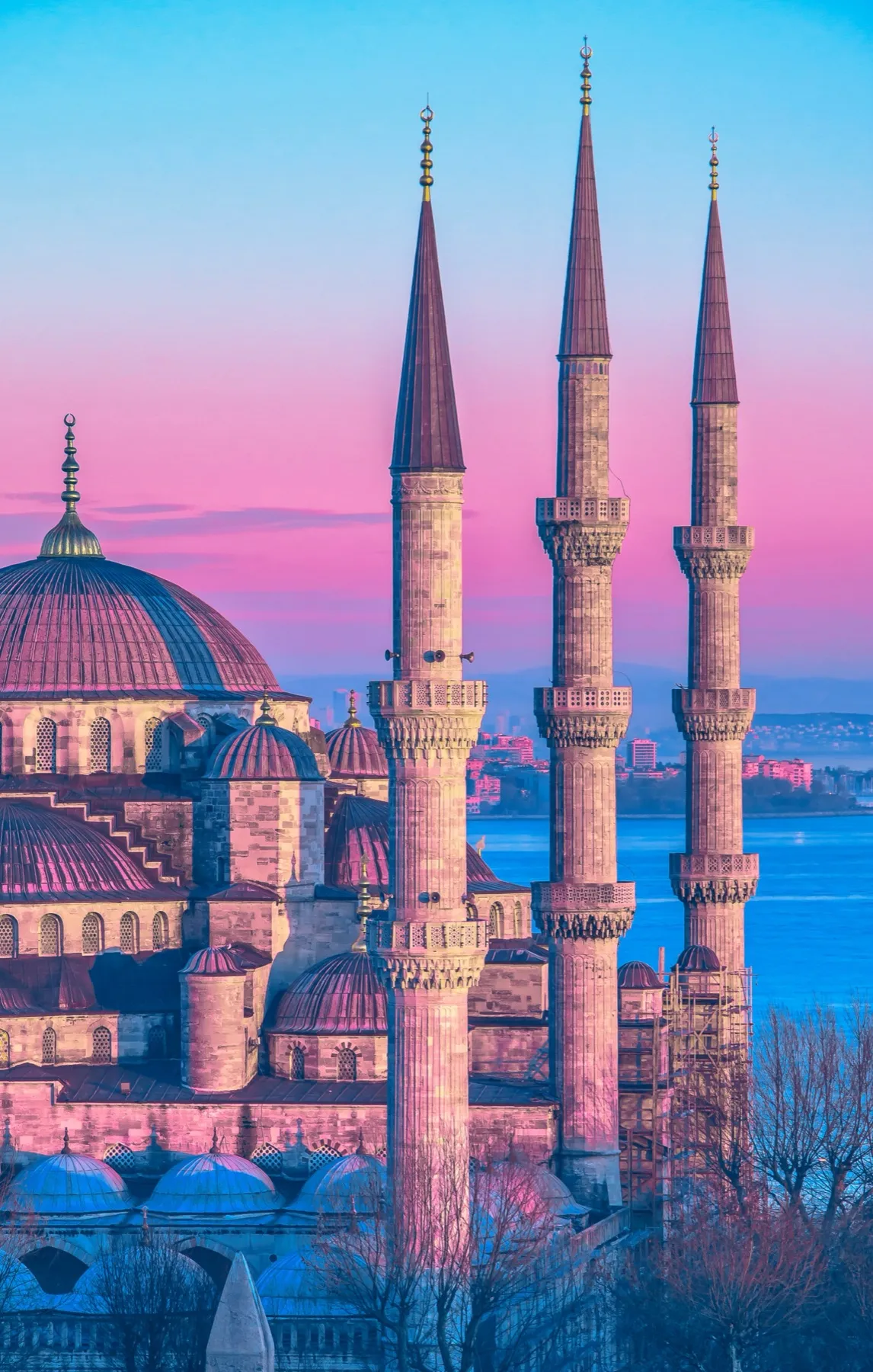 The minarets of the Blue Mosque against a pink sky