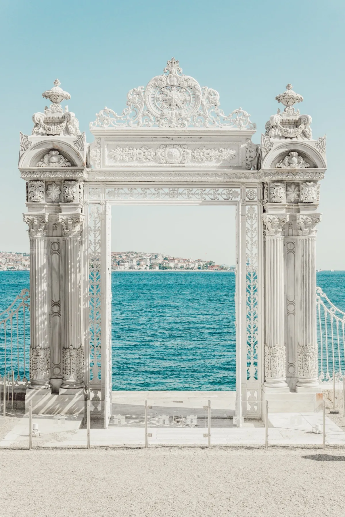 A white palace gate opening onto the Bosphorus